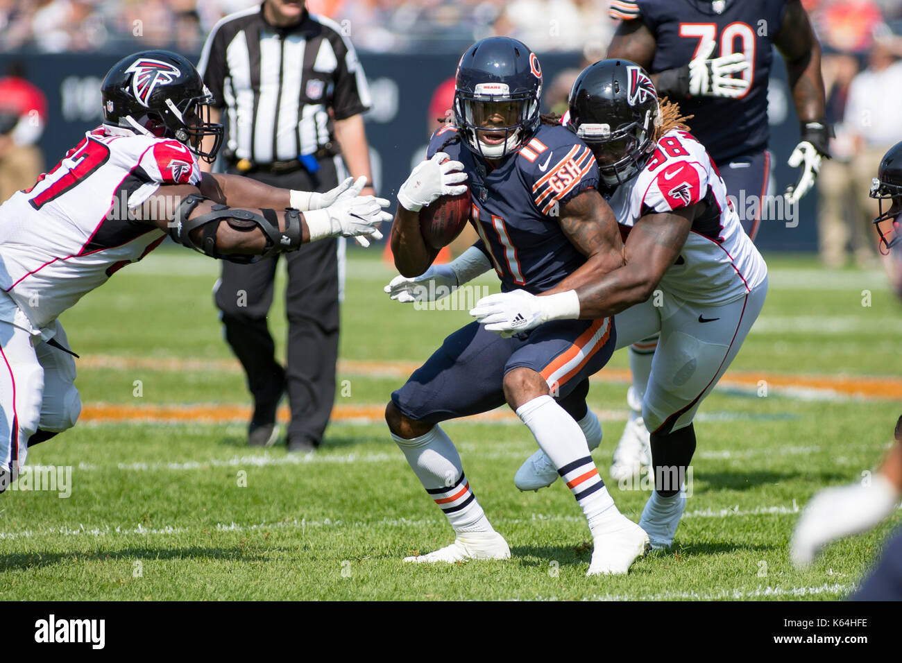 Chicago, Illinois, USA. 10th Sep, 2017. - An unsuspecting Chicago Bears #11 Kevin White gets tackled from behind by Atlanta Falcons #98 Takkarist McKinley resulting in White's broken left collarbone during the NFL Game between the Atlanta Falcons and Chicago Bears at Soldier Field in Chicago, IL. Credit: csm/Alamy Live News Stock Photo