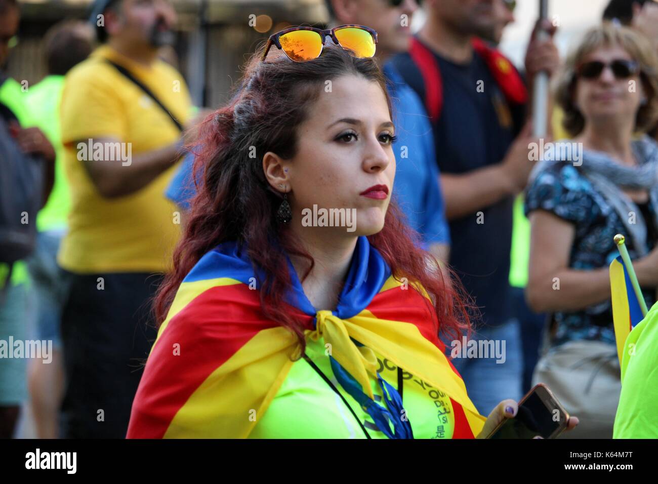 Barcelona, Spain. 11th Sep, 2017. People participating with Catalan independentist symbols at the Diada, the national day of Catalonia. Spain`s autonomous region aims to celebrate an independence referendum on October 1st. Credit: Dino Geromella/Alamy Live News Stock Photo