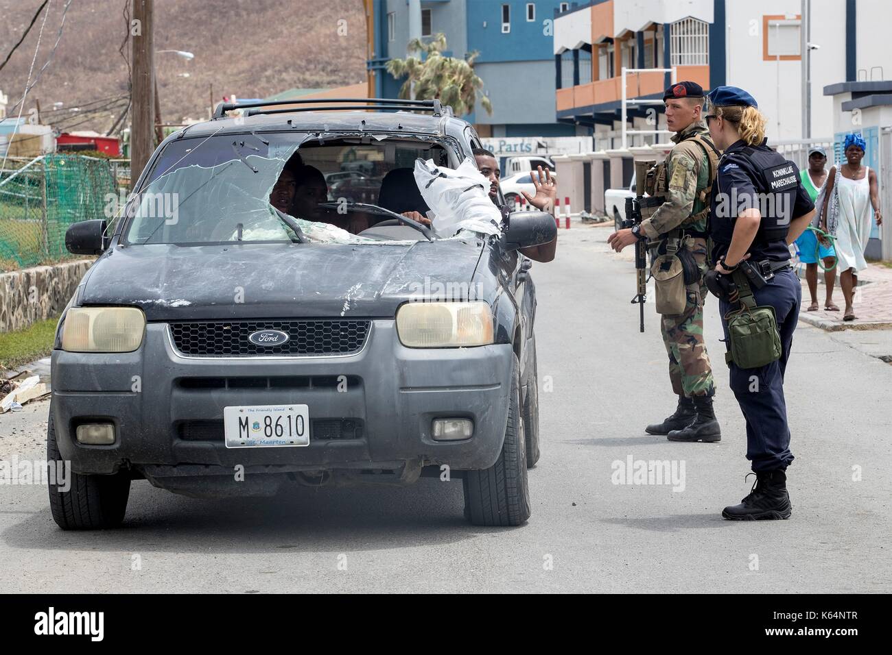 Dutch Marines and police check vehicles to prevent looting and assist residents in the aftermath of Hurricane Irma that devastated much of the island September 8, 2017 in Philipsburg, St. Maarten. Stock Photo