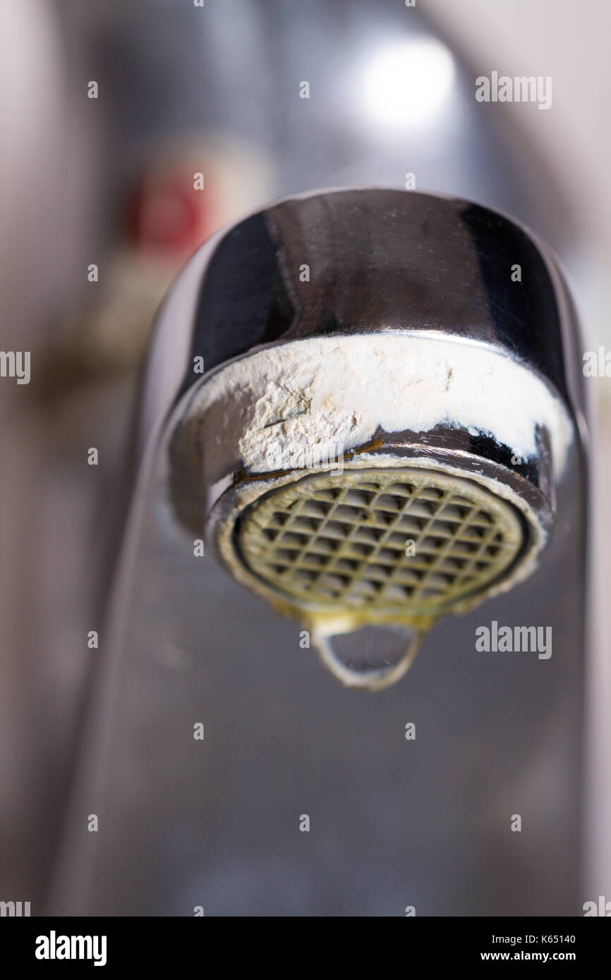 Old Leaking Faucet With Stone And Calcium Sediments Due To Hard