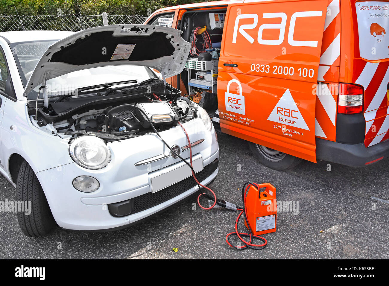 Close up RAC breakdown van in attendance tracing fault in broken down Fiat car diagnostic computer equipment connected direct to car by RAC mechanic Stock Photo