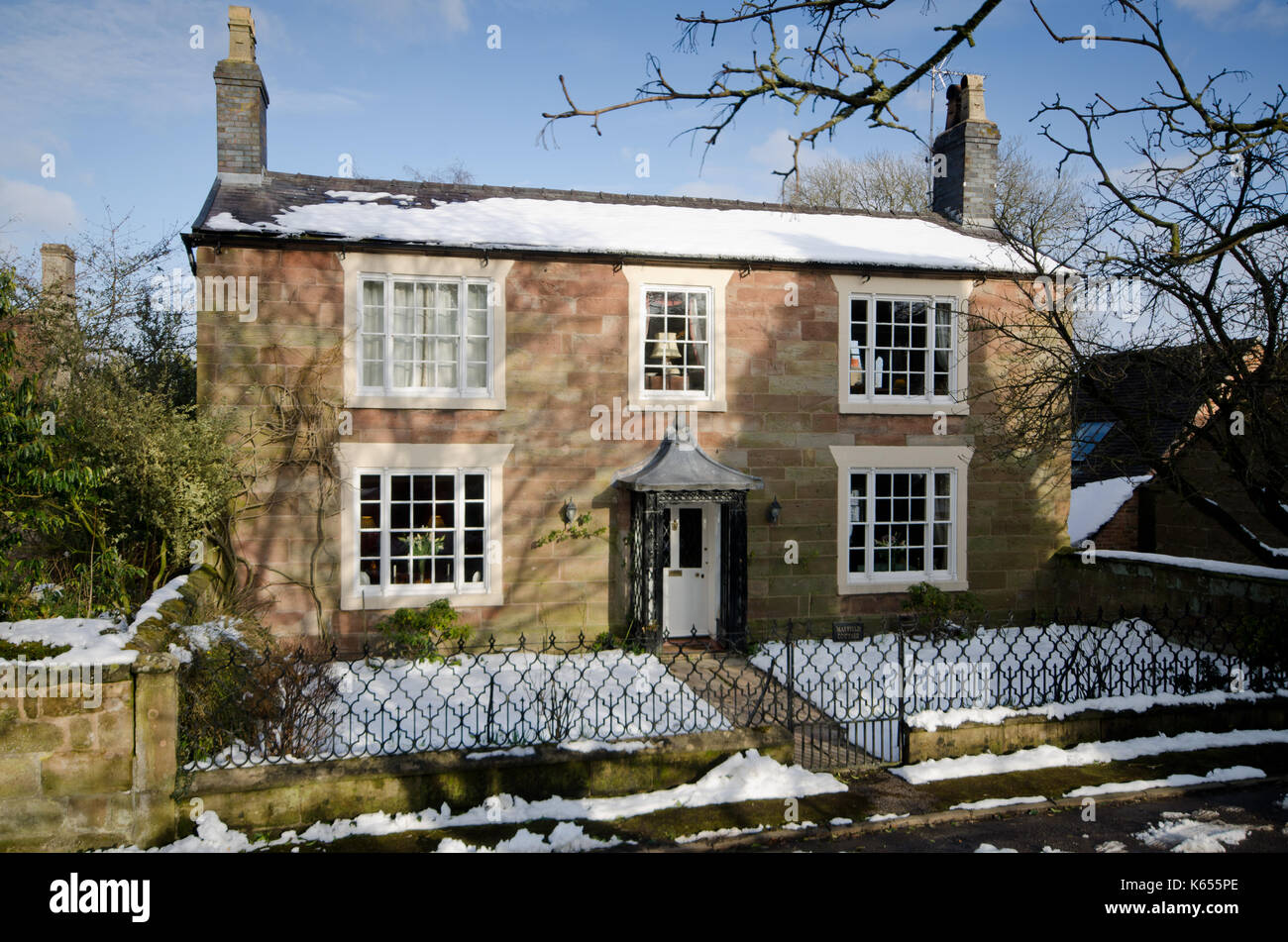 Period Peak District house in winter with snow Stock Photo