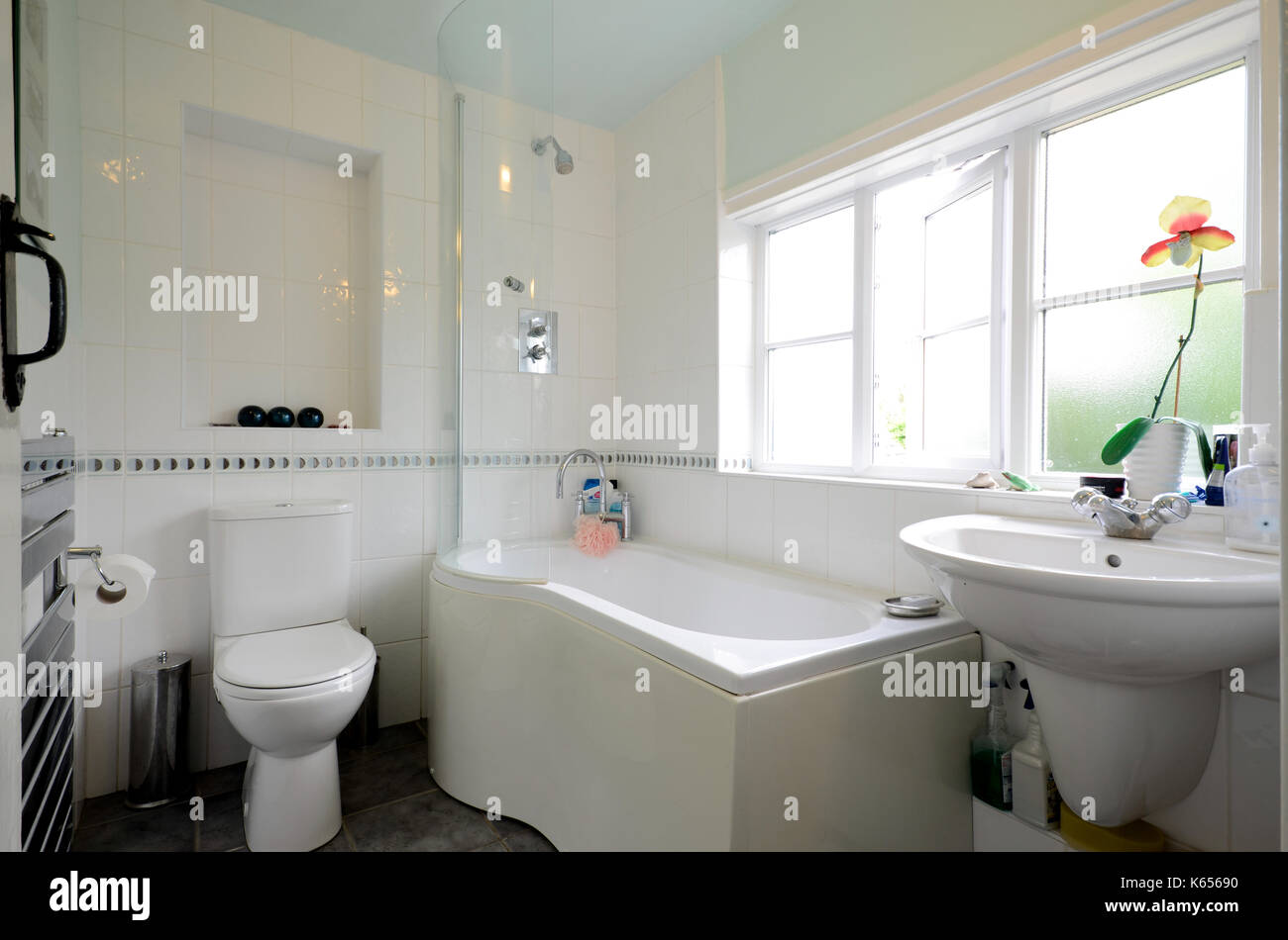 family bathroom with white curved bath Stock Photo