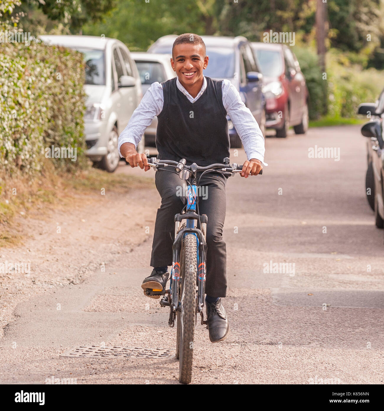 A teenage boy of 17 on his bike in the Uk Stock Photo