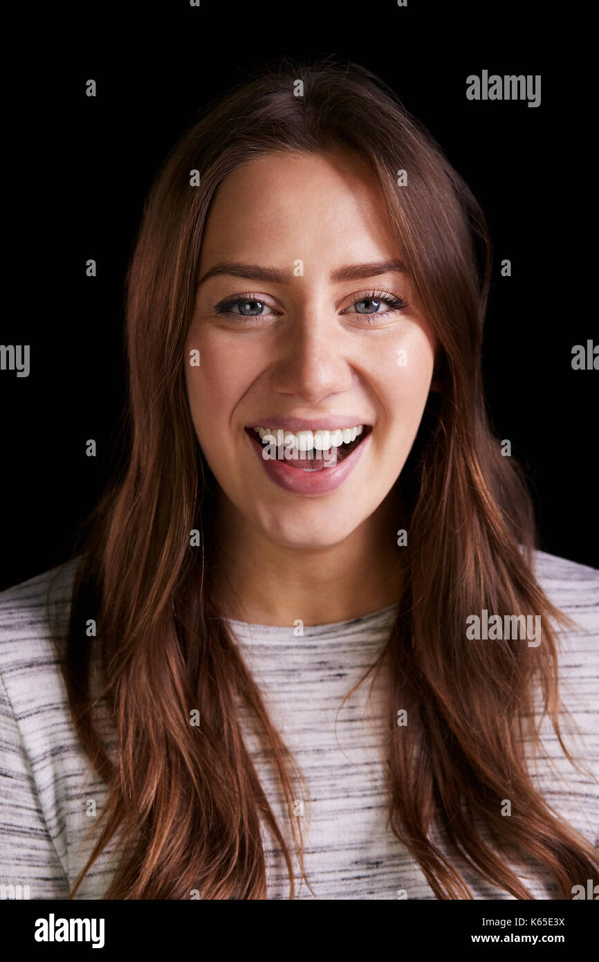 Head And Shoulders Studio Portrait Of Laughing Young Woman Stock Photo ...