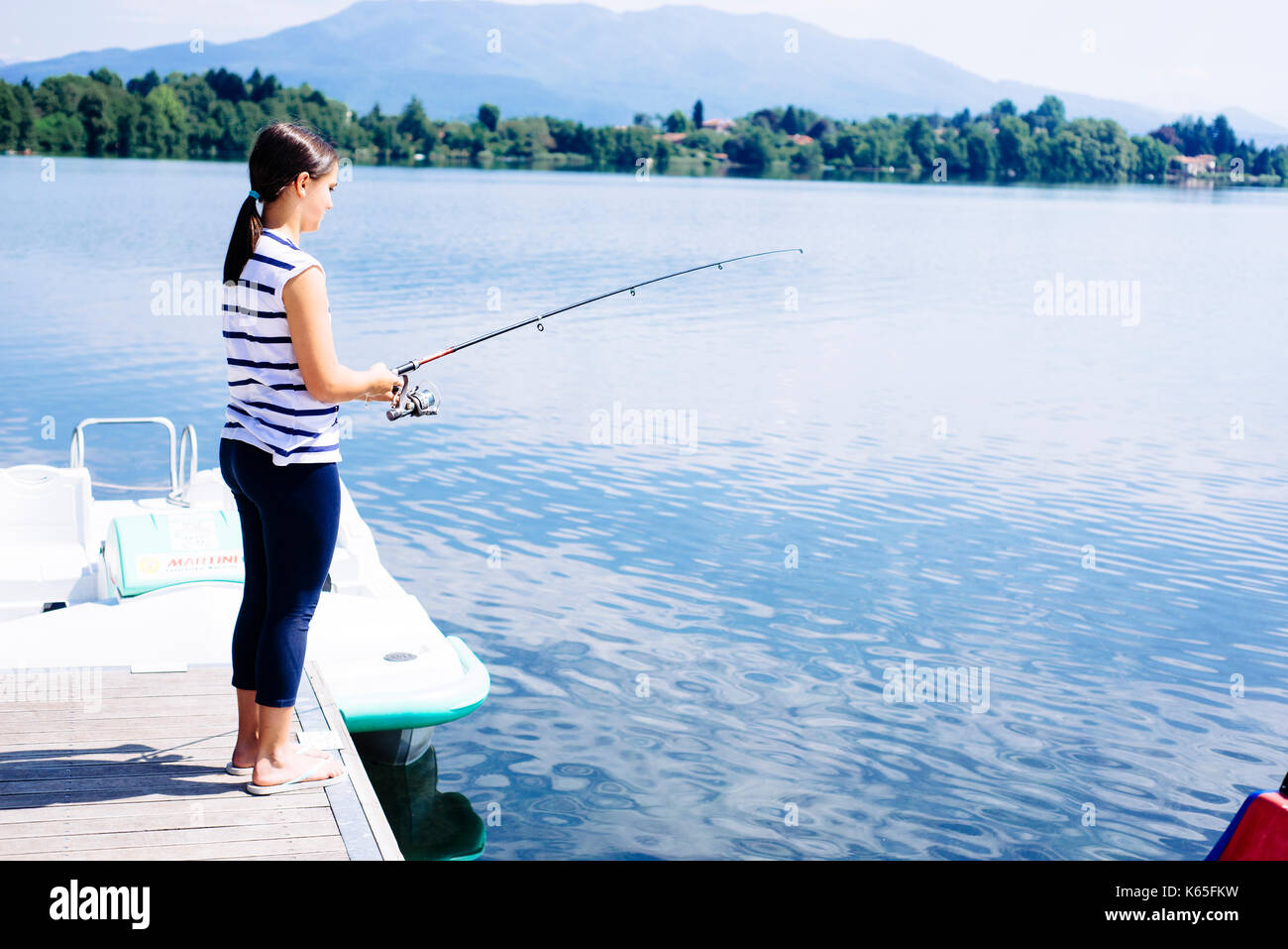 little girl fishing at the lake Stock Photo