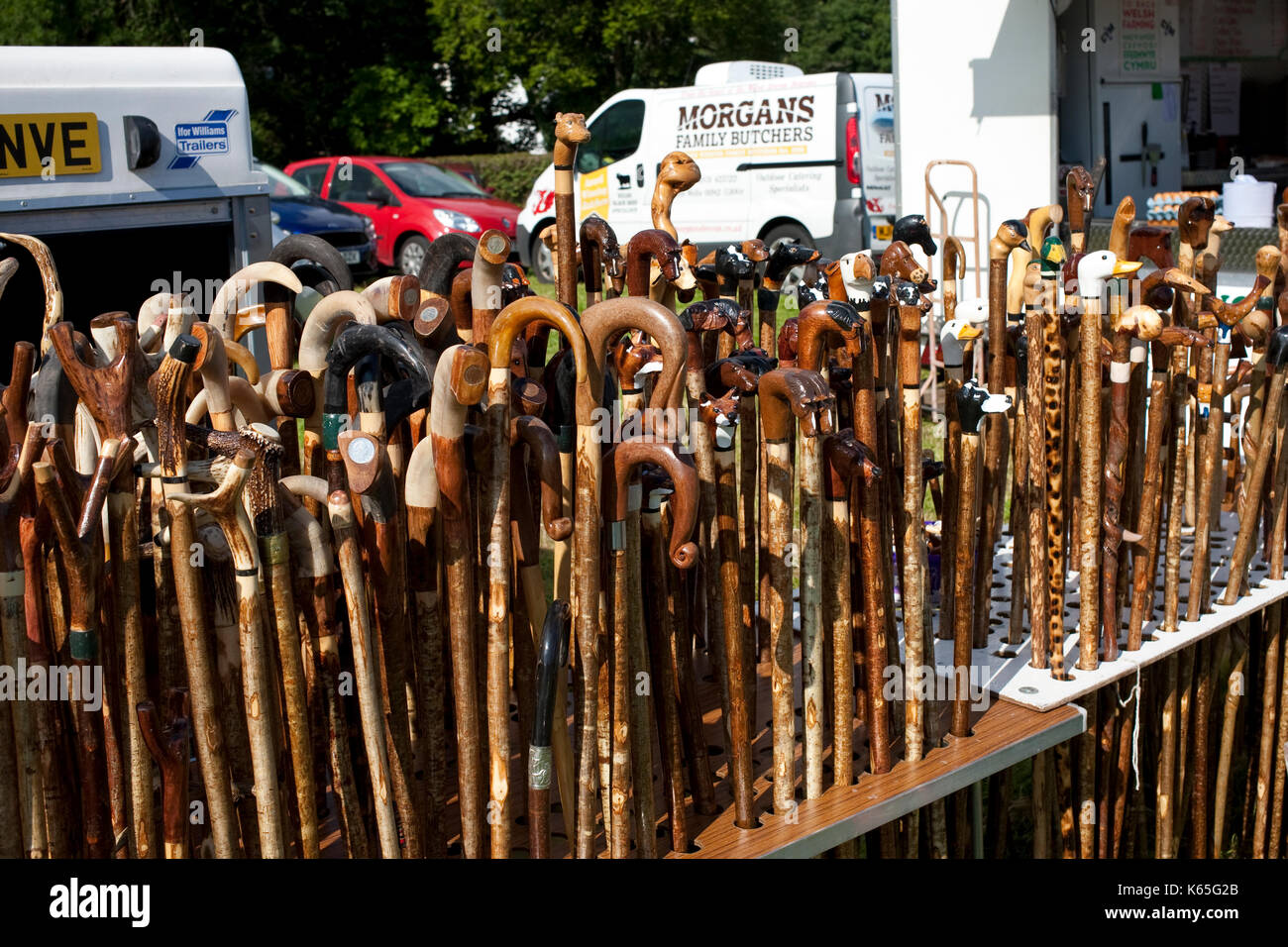 different shaped walking sticks and hiking canes on show at a market Stock Photo