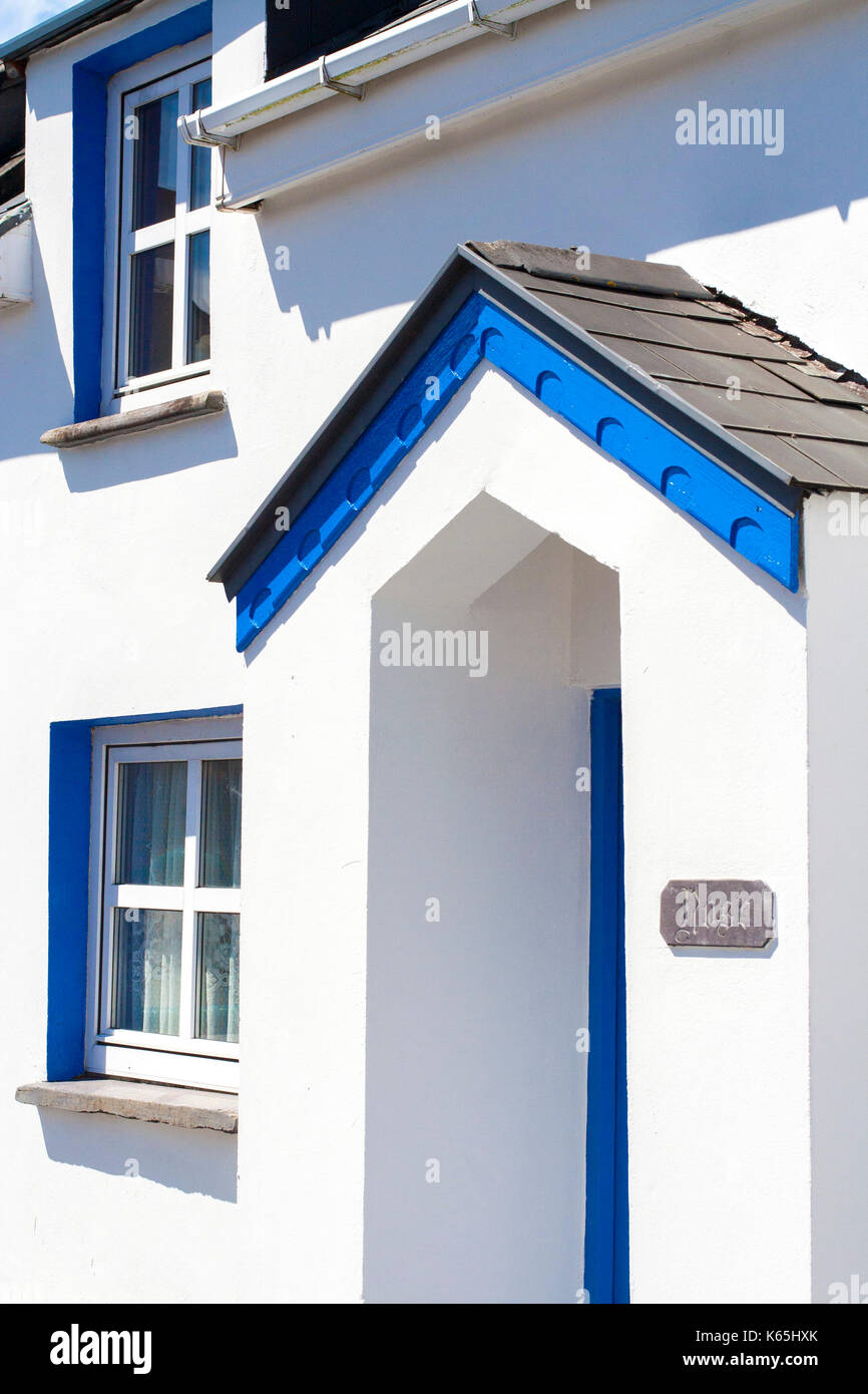 Small Blue and Bright White two storey cottage type houses with small
