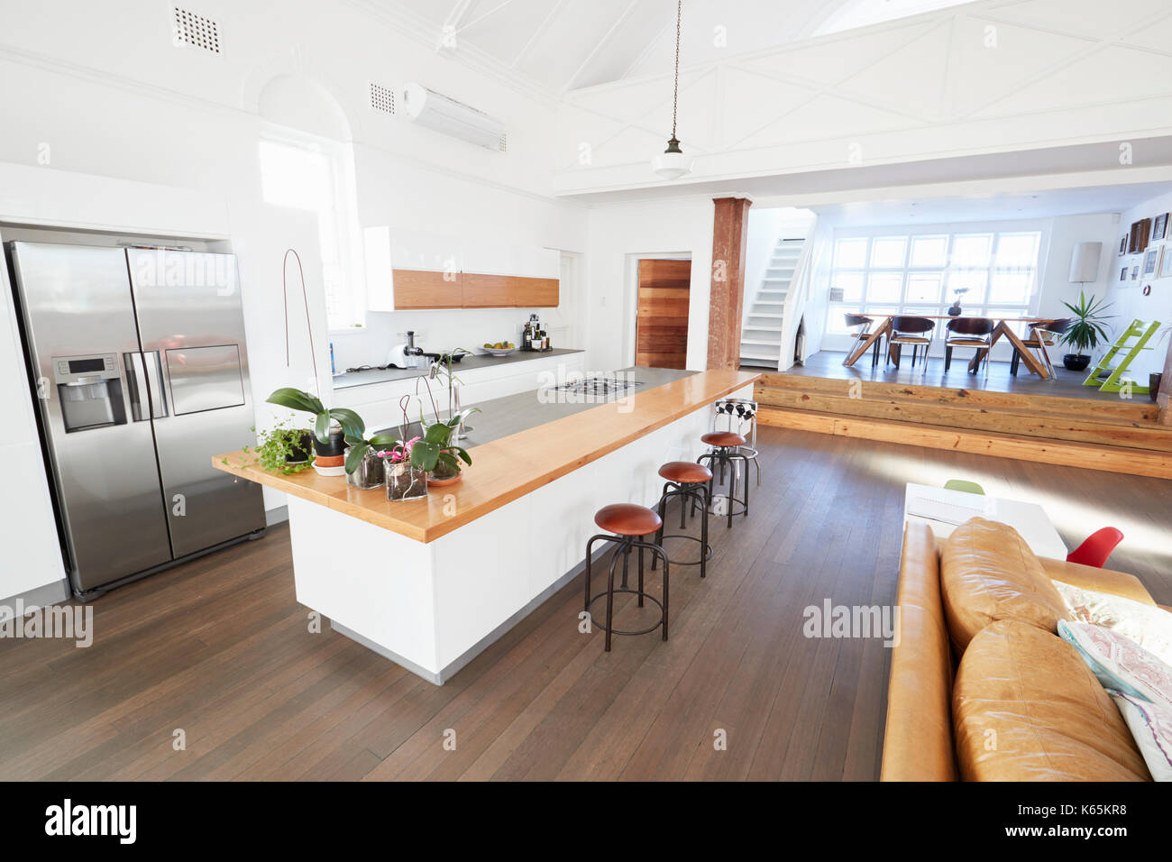 Home Interior With Open Plan Kitchen And Dining Area Stock Photo - Alamy