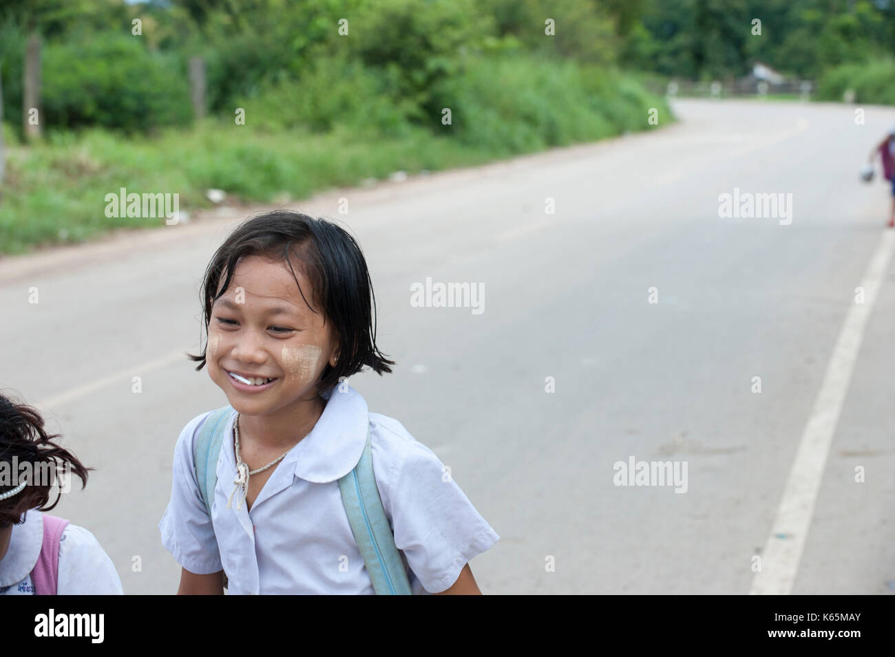 Burmese migrant children walk home from school near the dump site in the outskirts of Mae Sot, Thailand. Stock Photo