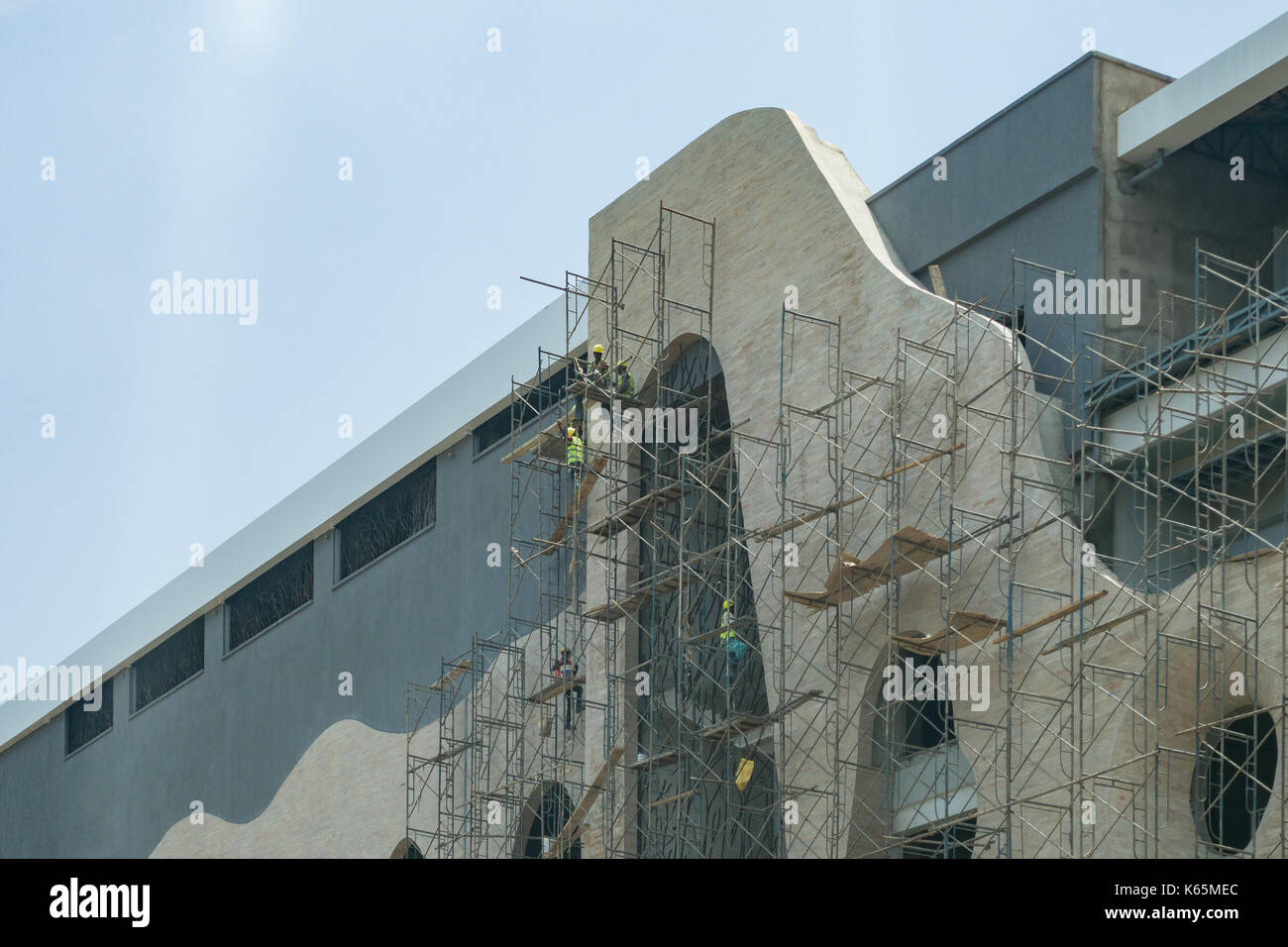 Workers on scaffolding of Village Market extension building under construction, Kenya Stock Photo