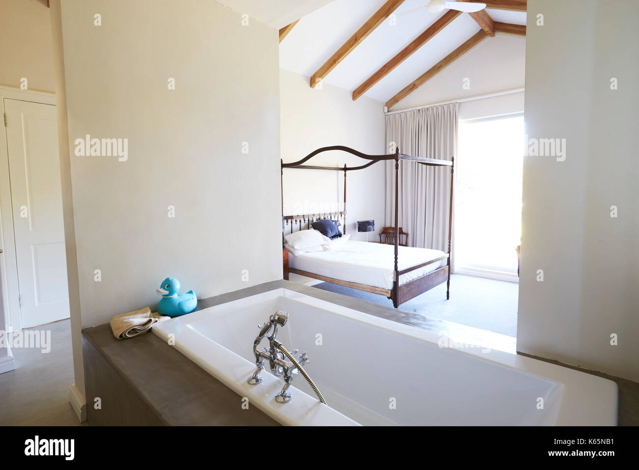 Interior Of Contemporary Open Plan Bedroom With Bath Stock Photo - Alamy