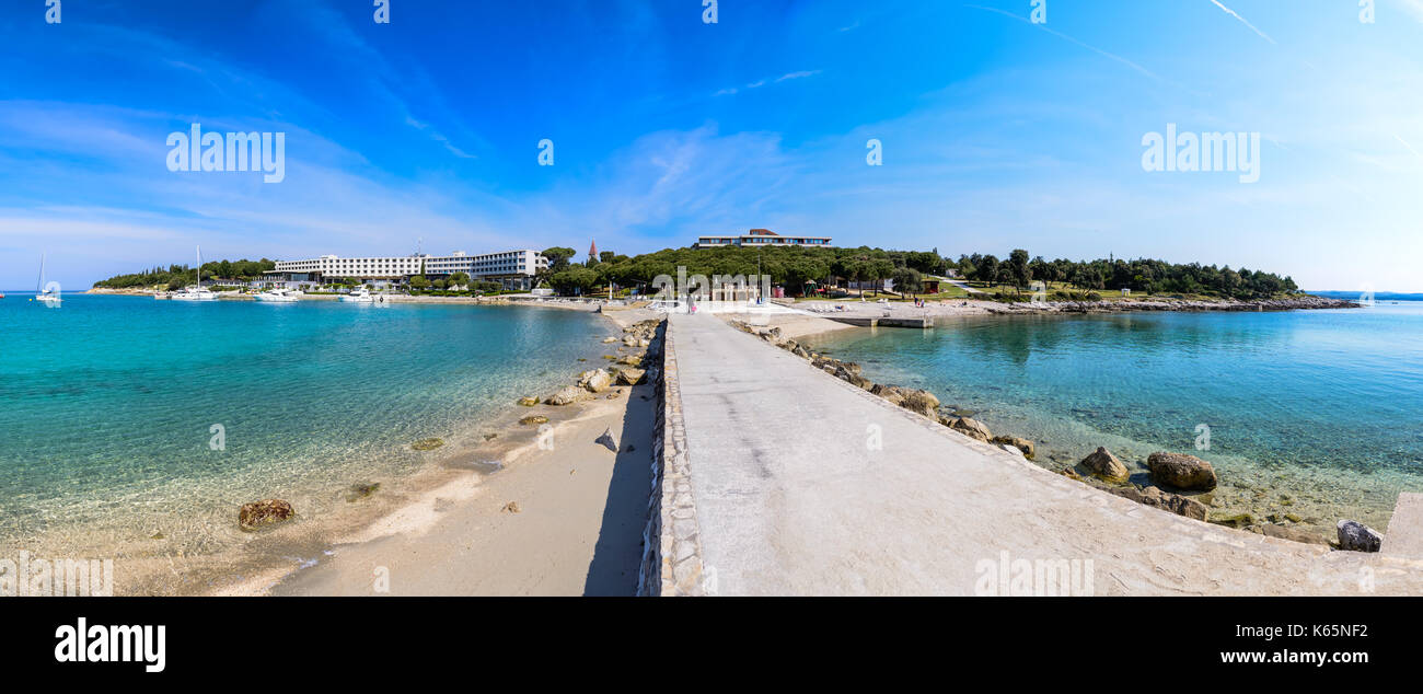 Seaside hotel with beach and turquoise water, Sveti Andrija or Red island near Rovinj, Croatia