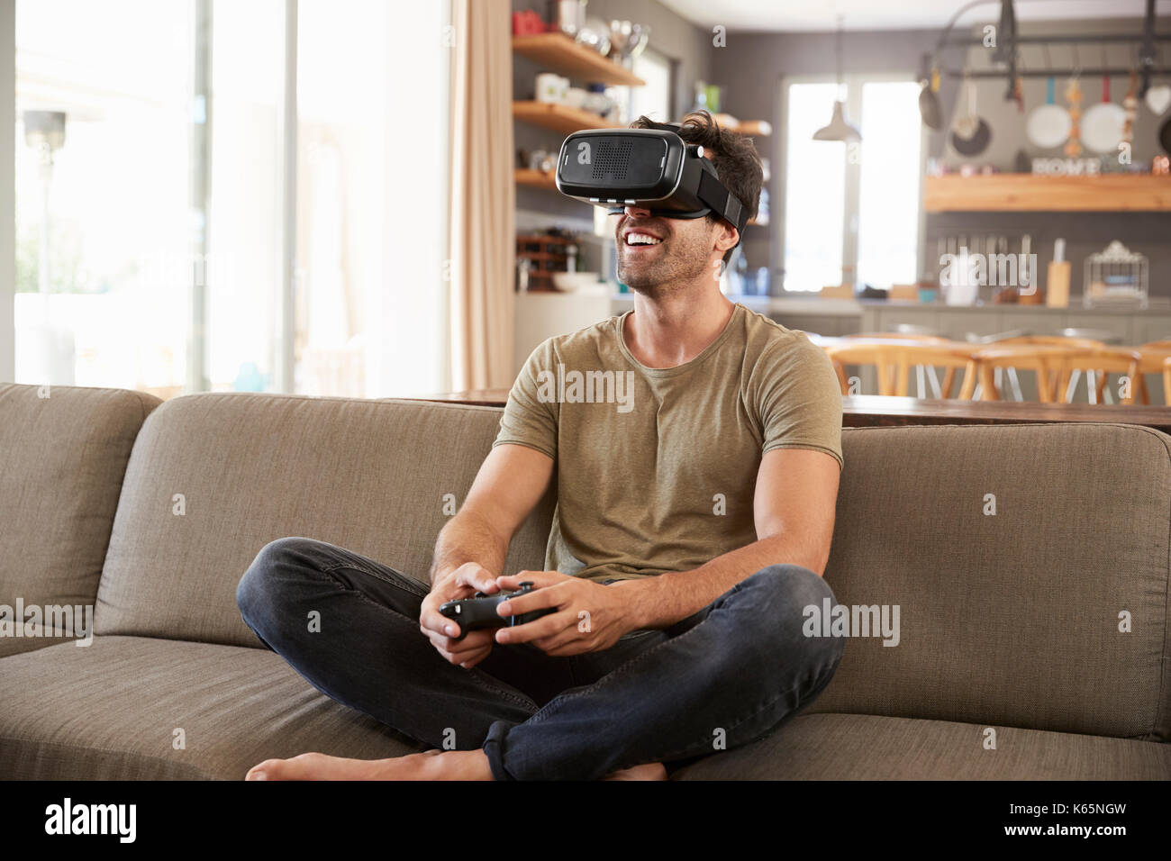 Man Playing Computer Game Wearing Virtual Reality Headset Stock Photo