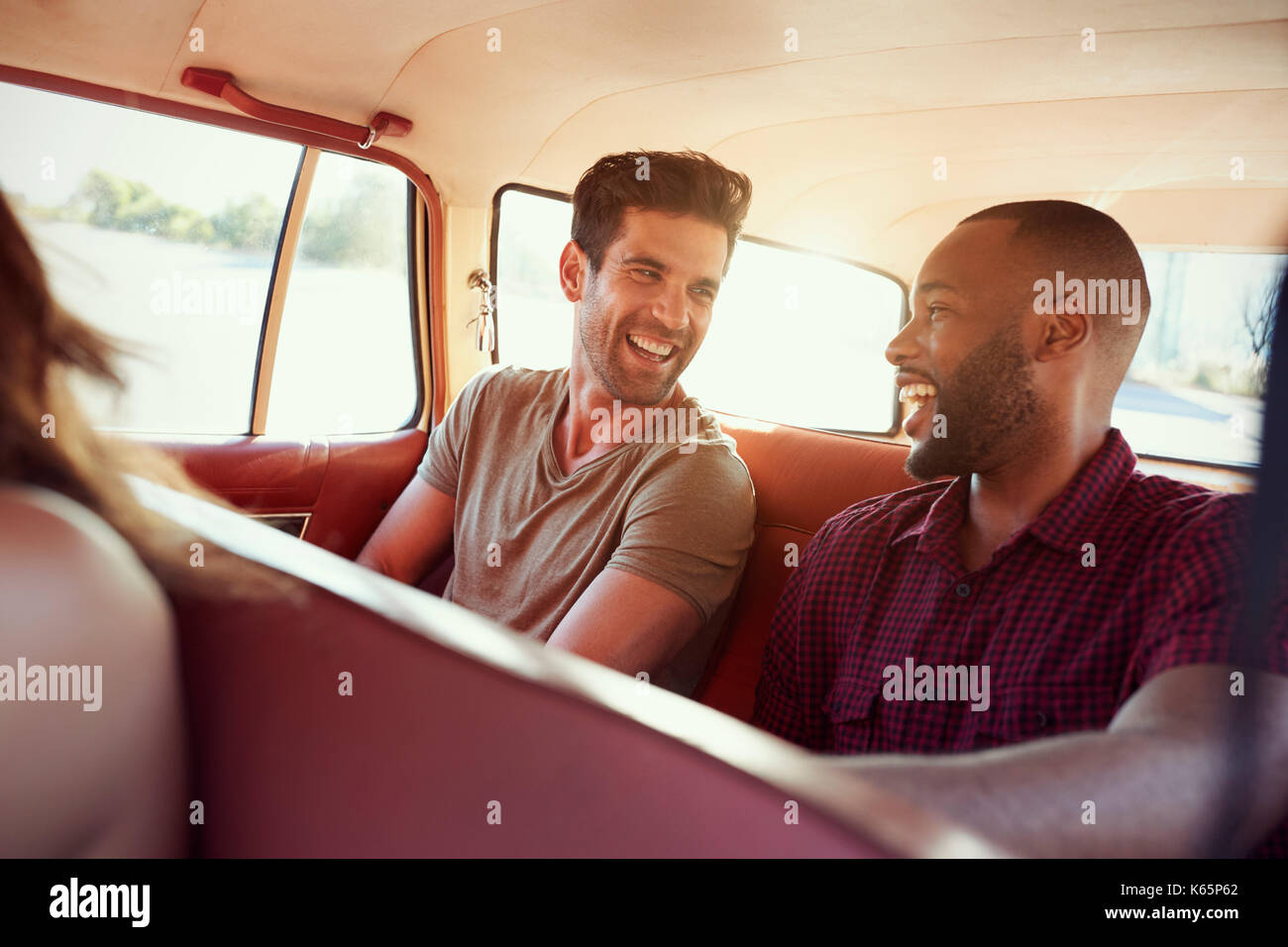 Group Of Friends Relaxing In Car During Road Trip Stock Photo