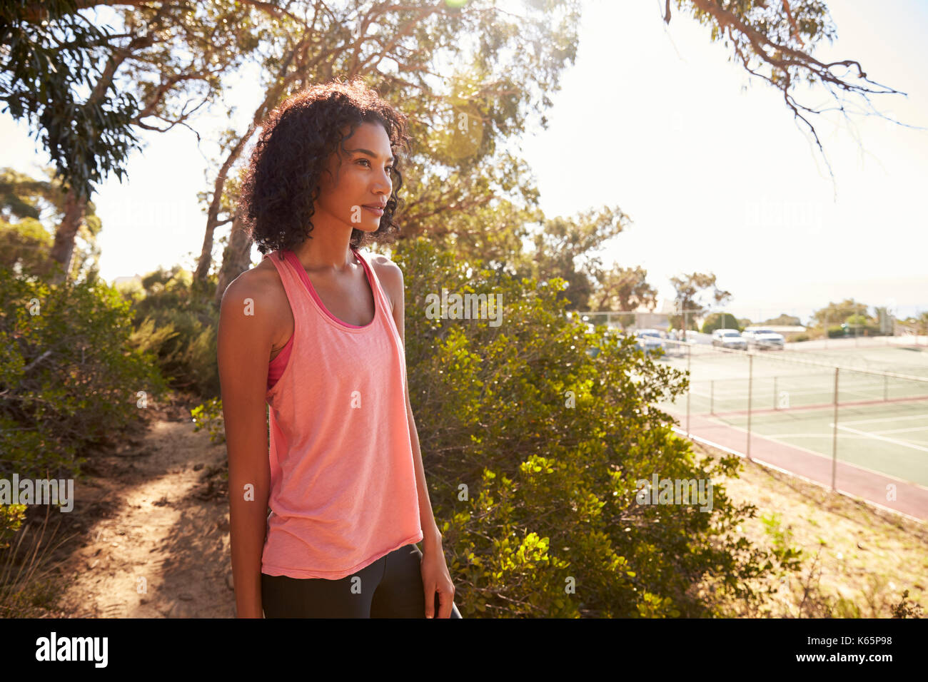Young black woman taking a break during her run Stock Photo