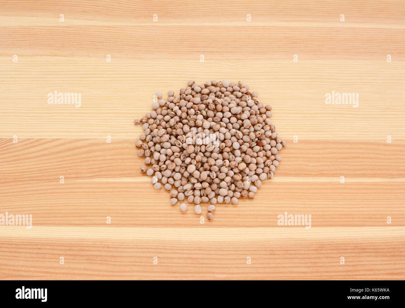 Pigeon peas on a wooden background, pine wood grain Stock Photo