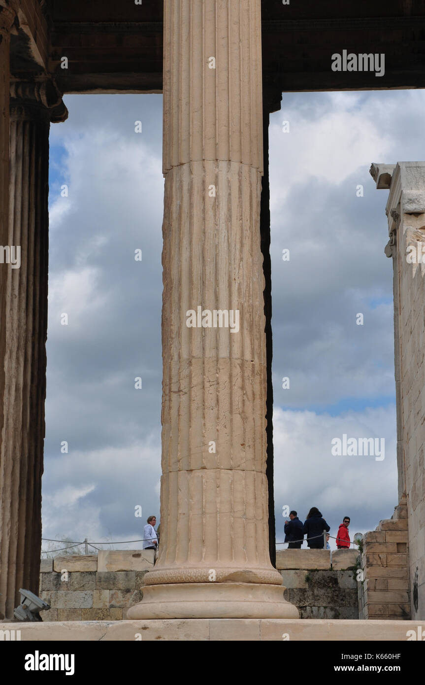 ATHENS, GREECE - MAY 6, 2014: People and ancient marble column at the Acropolis of Athens, Greece. Stock Photo