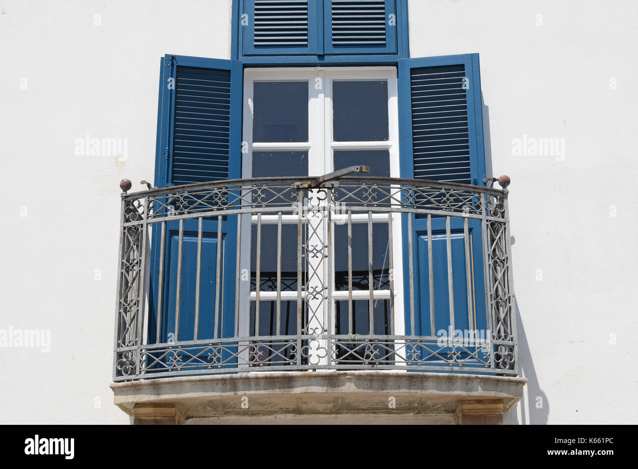 Glass door wooden shutters and veranda exterior. Architectural detail. Stock Photo