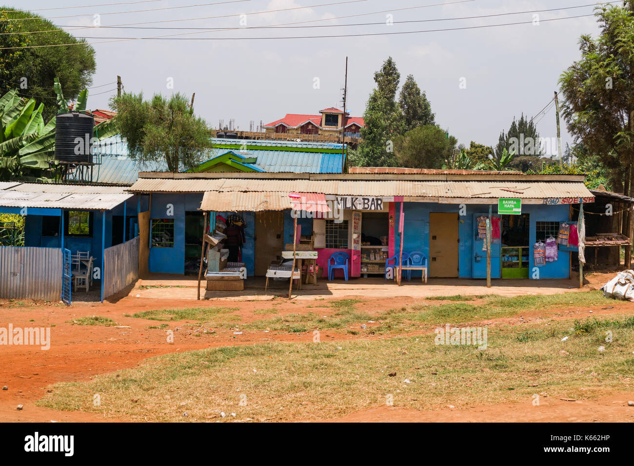 Small building by road with shops and bar, Kenya Stock Photo Alamy