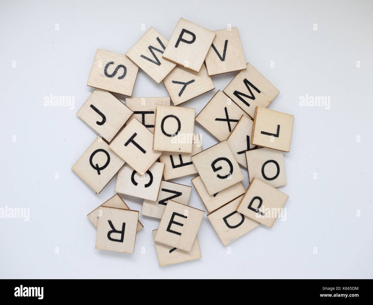 A messy pile of wooden letter tiles. Stock Photo