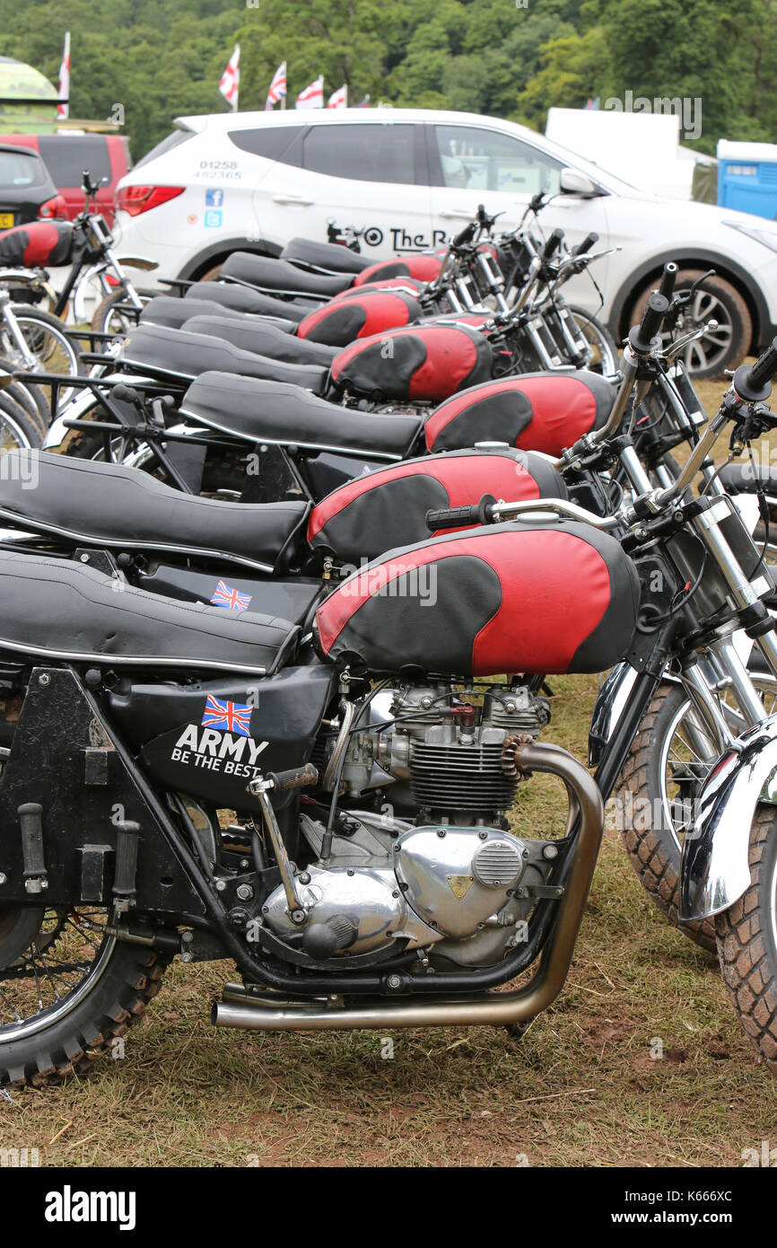 The Royal Signals Regiment, White Helmets motorcycle display team in action at Lowther Castle Horse Trials, Cumbria, England. Stock Photo