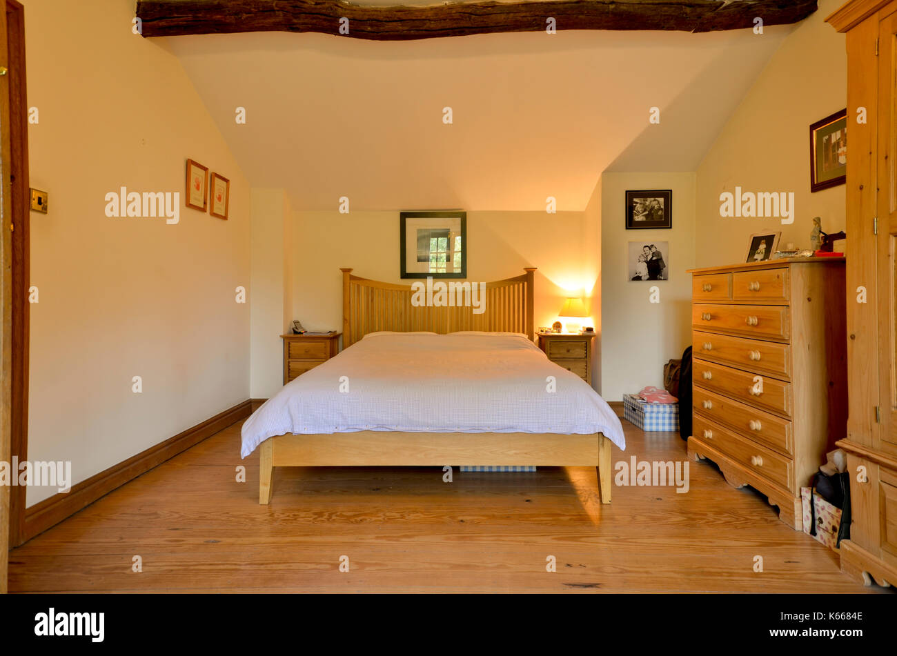 Guest bedroom in cottage with exposed beam Stock Photo