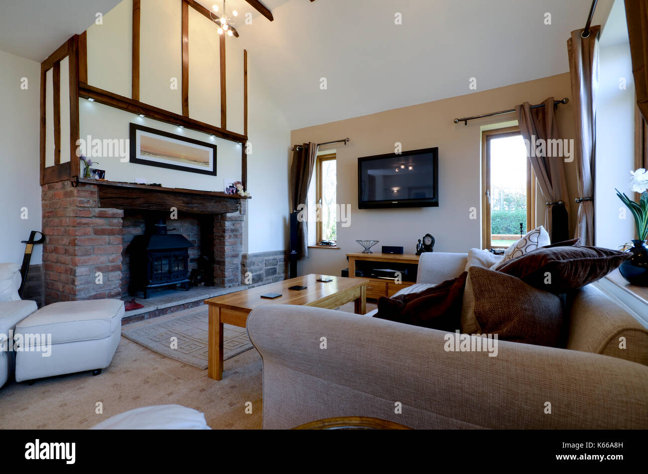 Sitting room in executive home with wood burning stove Stock Photo