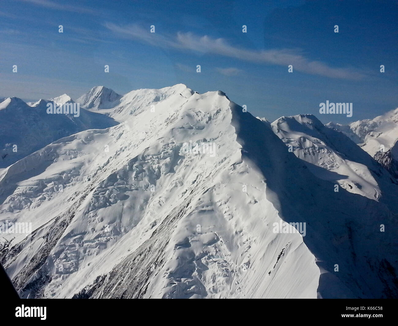 AERIAL VIEW OF SNOW CAPPED MOUNTAINS, ALASKA Stock Photo - Alamy