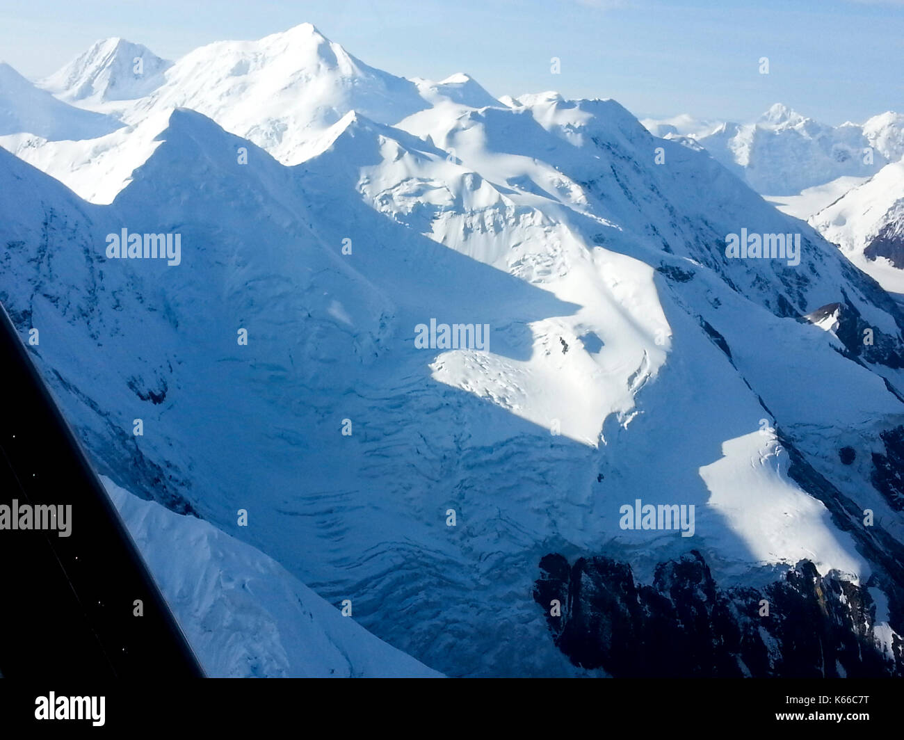 AERIAL VIEW OF SNOW CAPPED MOUNTAINS, ALASKA Stock Photo - Alamy