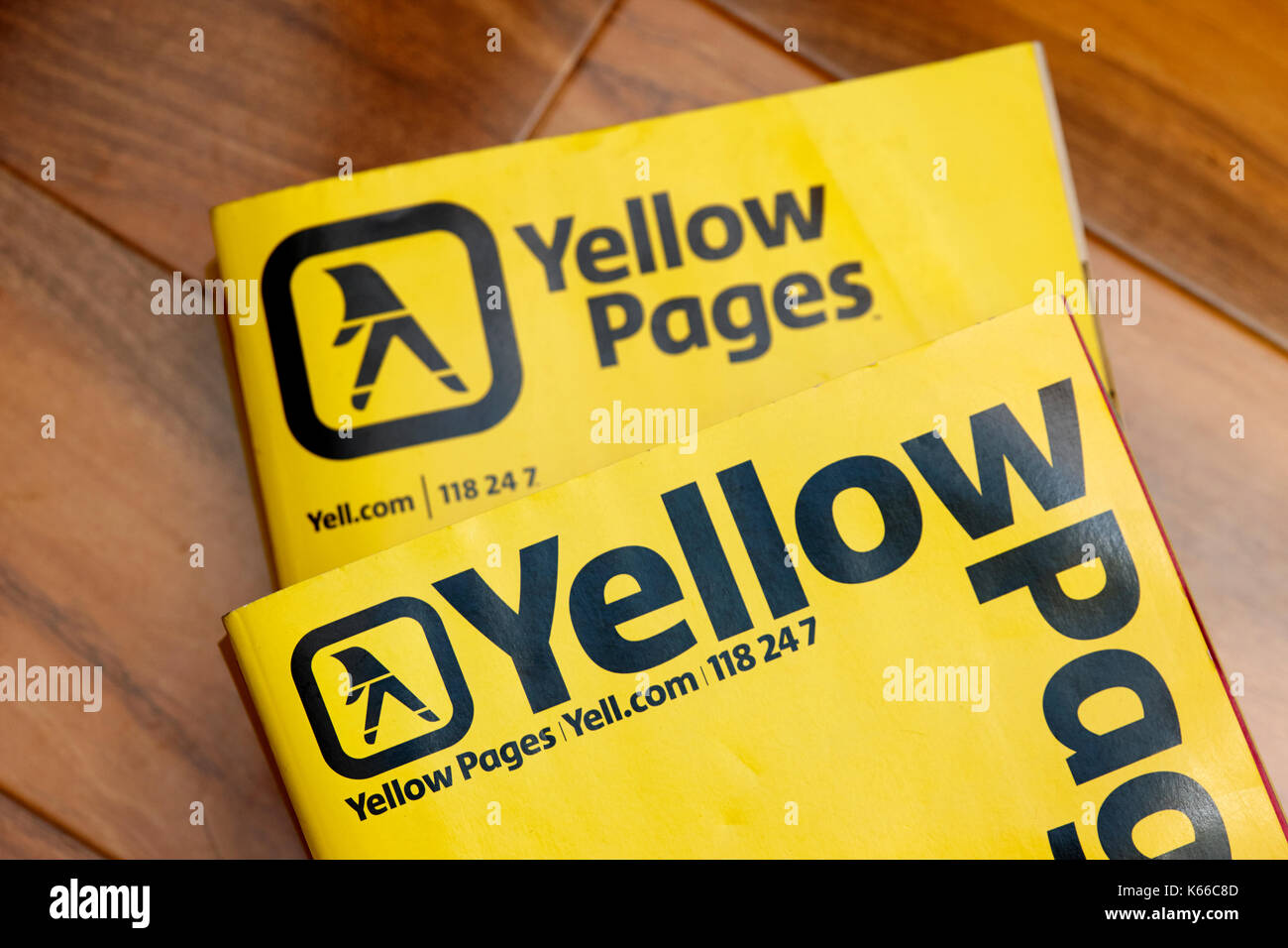 larger older versions of yellow pages classified telephone directory paper edition uk Stock Photo