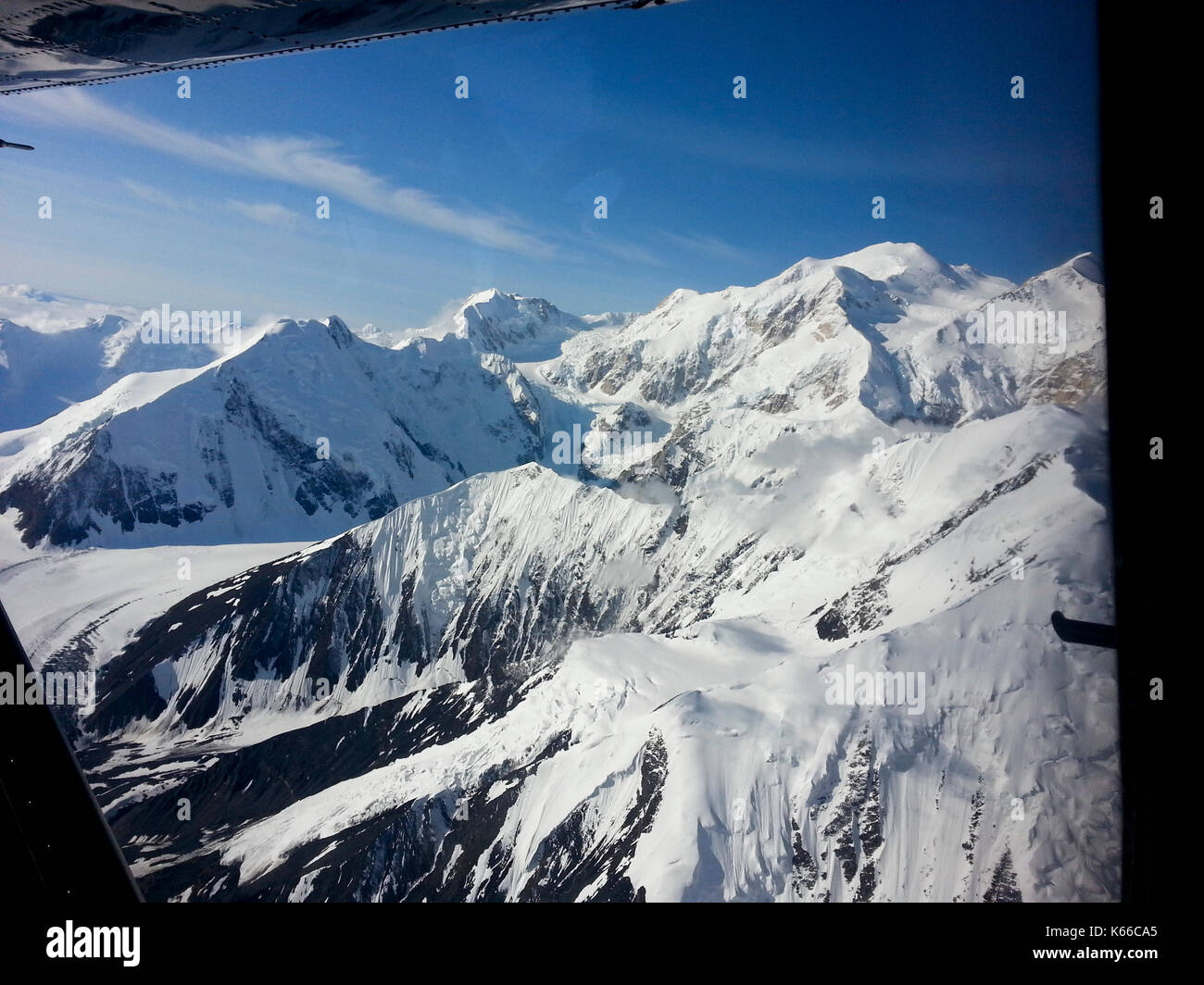 AERIAL VIEW OF SNOW CAPPED MOUNTAINS, ALASKA Stock Photo - Alamy