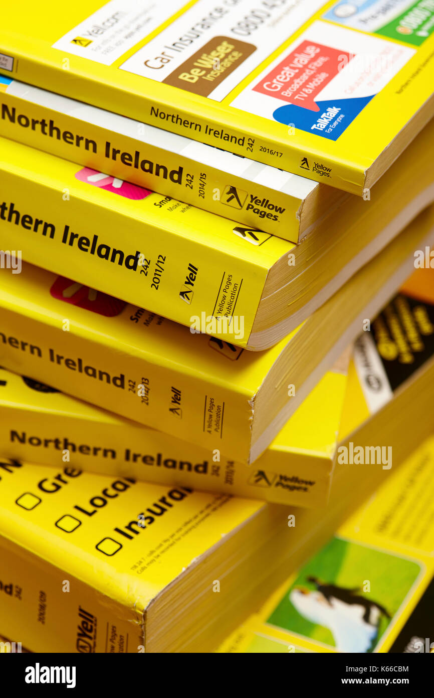 decreasing size later smaller thinner versions of the yellow pages classified telephone directory paper edition uk Stock Photo