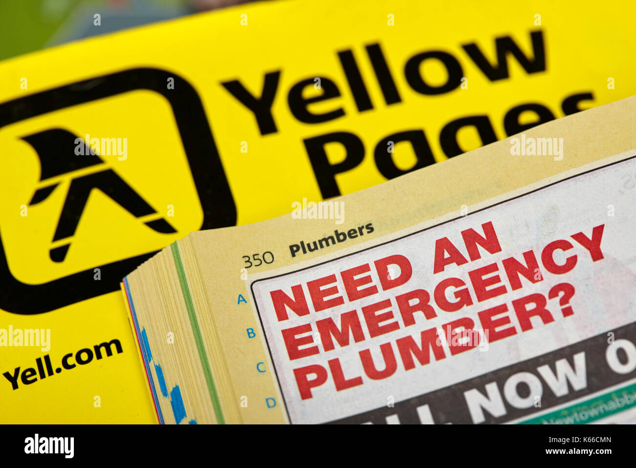 plumbers section of small single entry business listings in yellow pages classified telephone directory paper edition uk Stock Photo