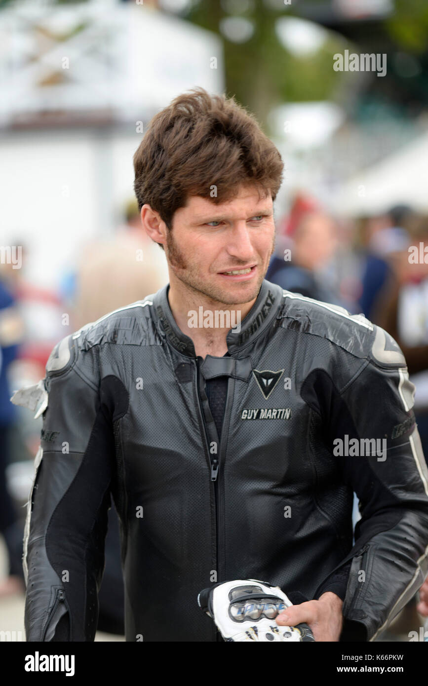 Guy Martin - motorcycle racer and tv celebrity - at the Goodwood Revival 2017 in black motorcycle riding leathers Stock Photo