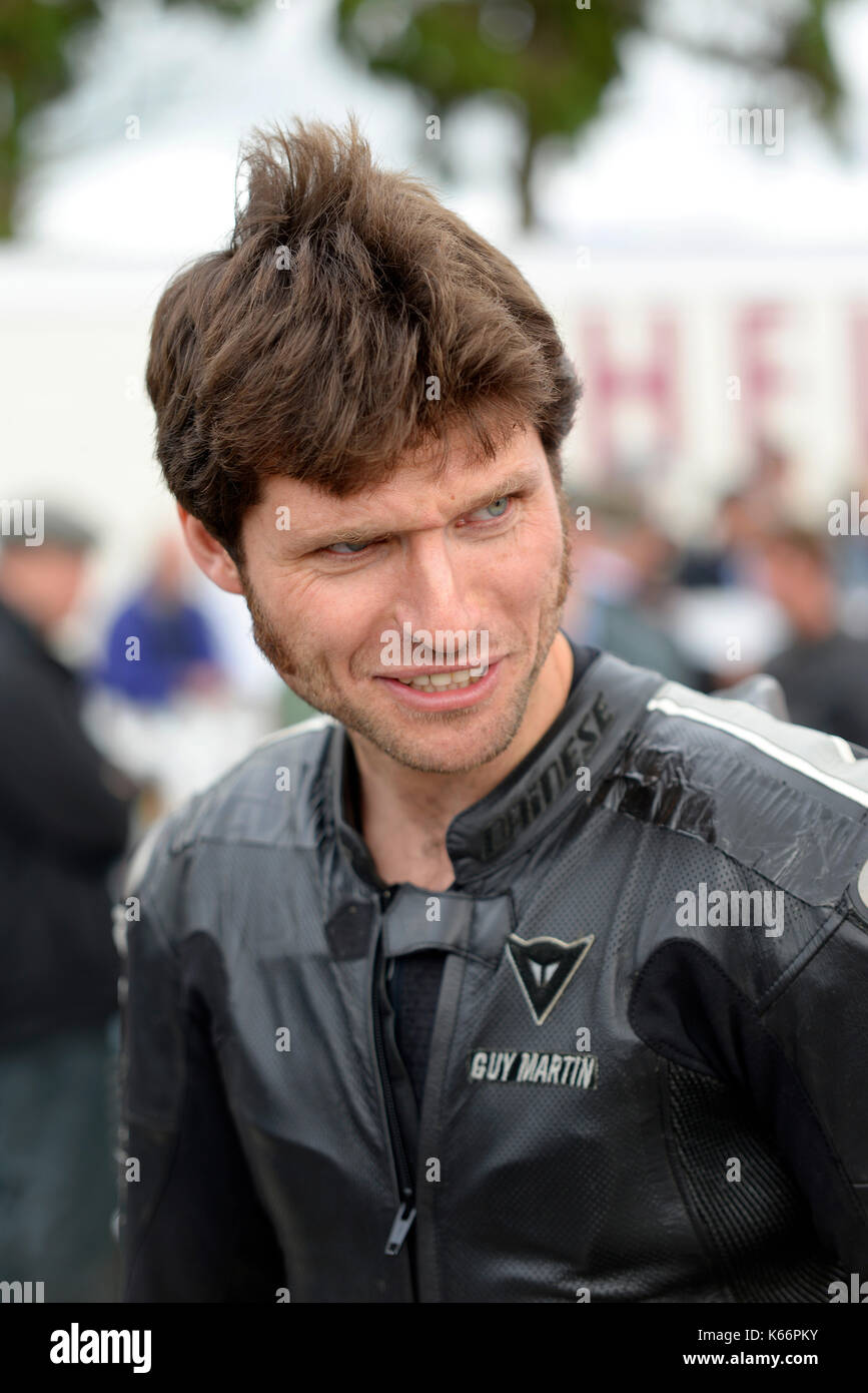 Guy Martin - motorcycle racer and tv celebrity - at the Goodwood Revival 2017 in black motorcycle riding leathers Stock Photo