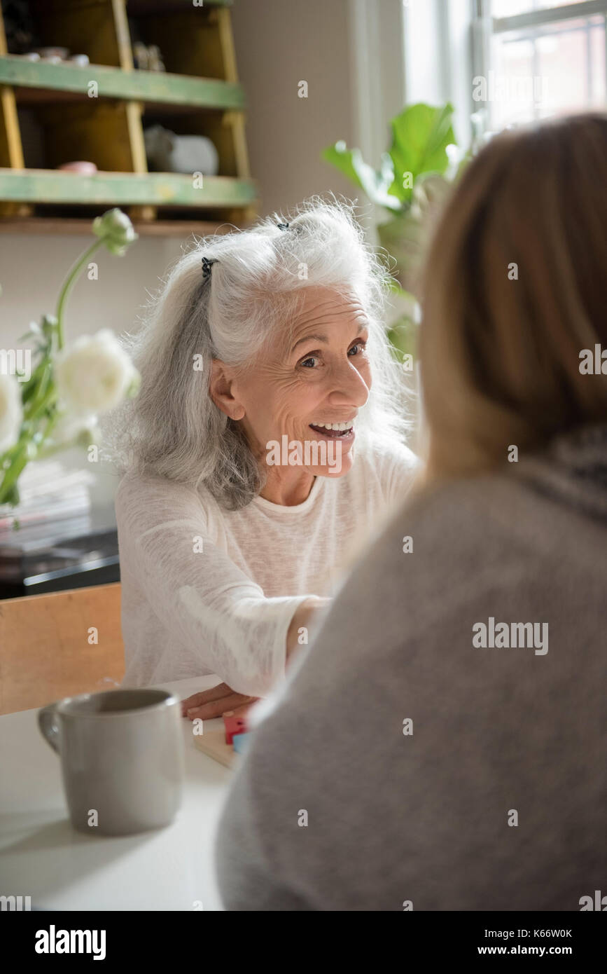 Older woman talking with daughter Stock Photo