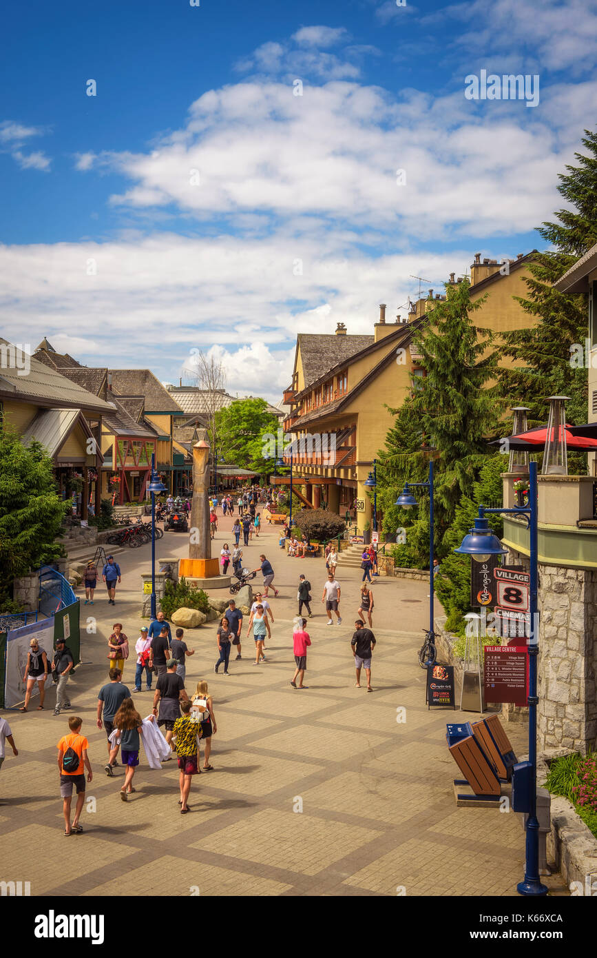 Scenic street view with many tourists  in Whistler Village. Stock Photo