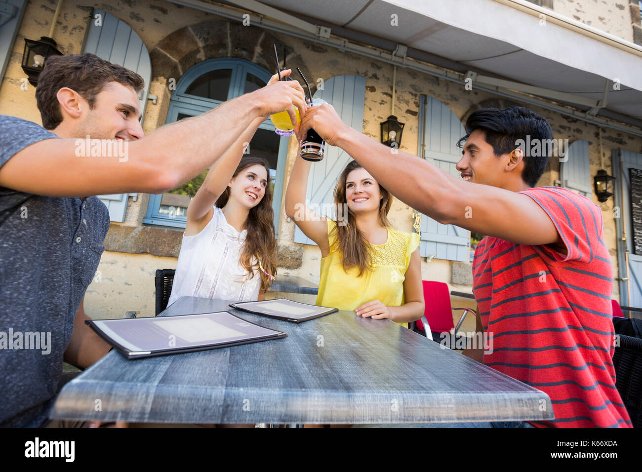 Friends toasting at restaurant Stock Photo