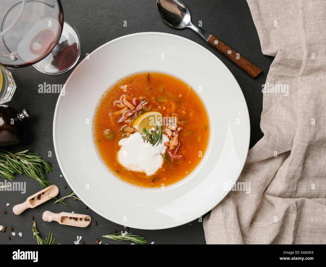 Brown soup in bowl with sour cream Stock Photo
