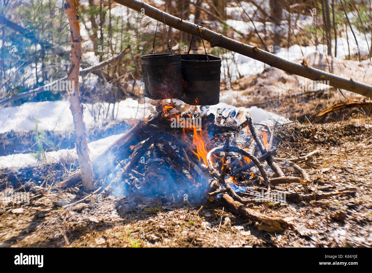 Food cooking in pots over a campfire Stock Photo - Alamy