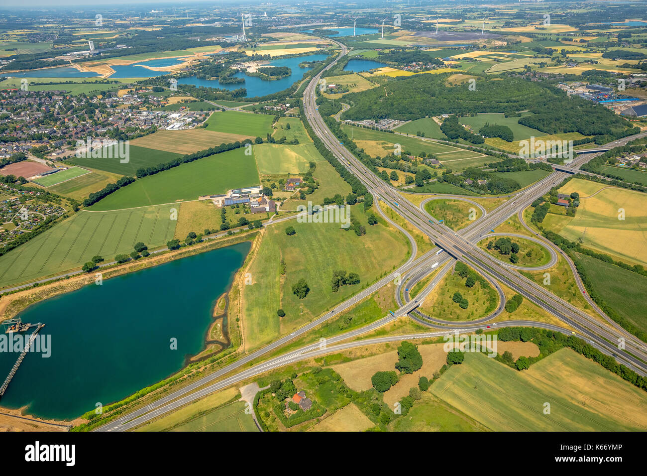 Motorway junction A57 and A52, the end of de A52, FRIKA gravel GmbH & Co. KG, gravel pit, quarry pond Haarbeck road, Kamp-Lintfort, Ruhr area, North R Stock Photo