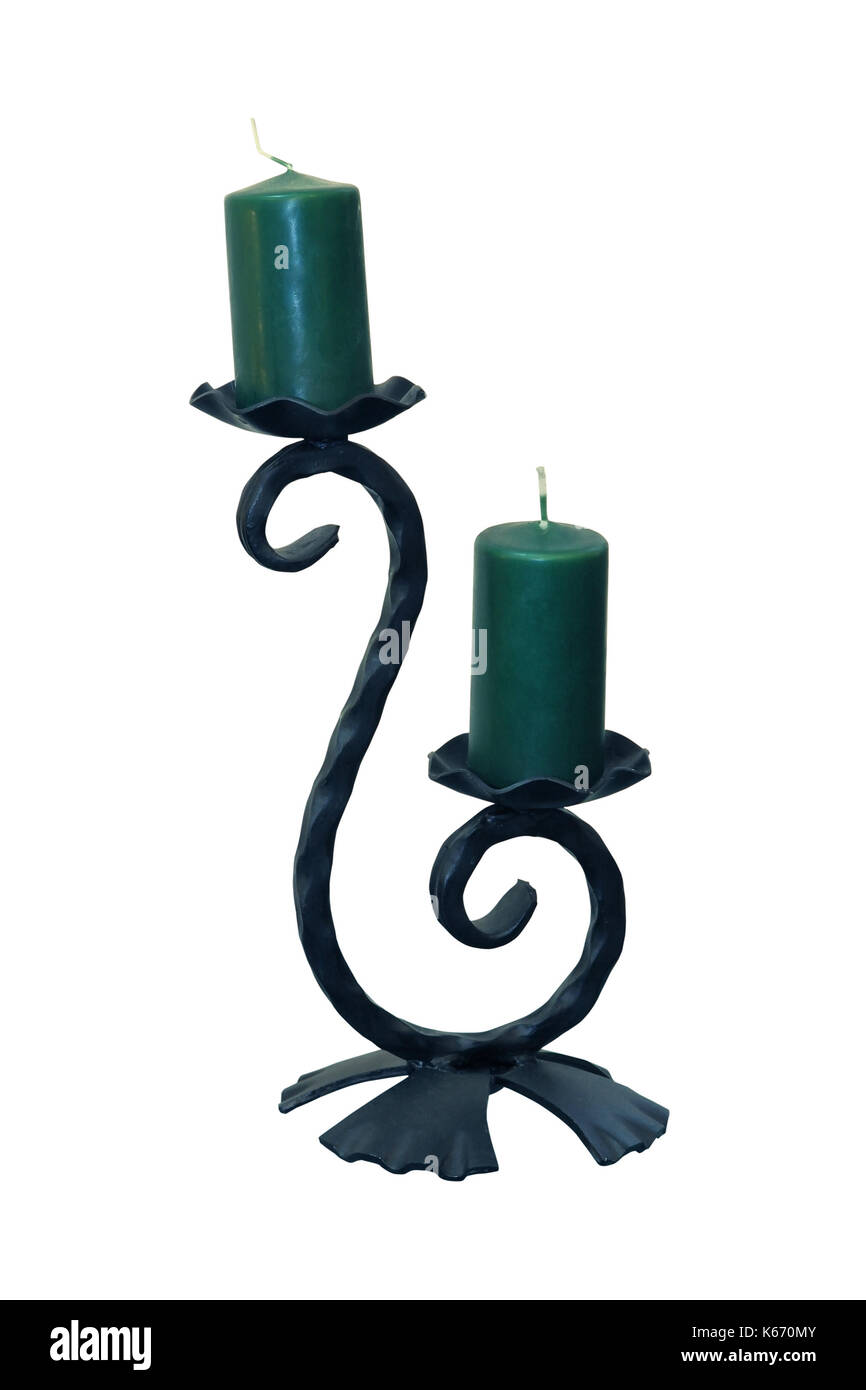 Vintage iron candlestick with green candles isolated with clipping path