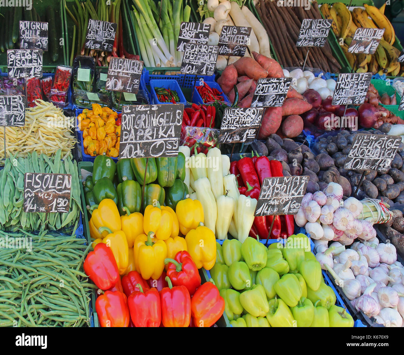 Organic vegetables piles sold on market stall Stock Photo - Alamy