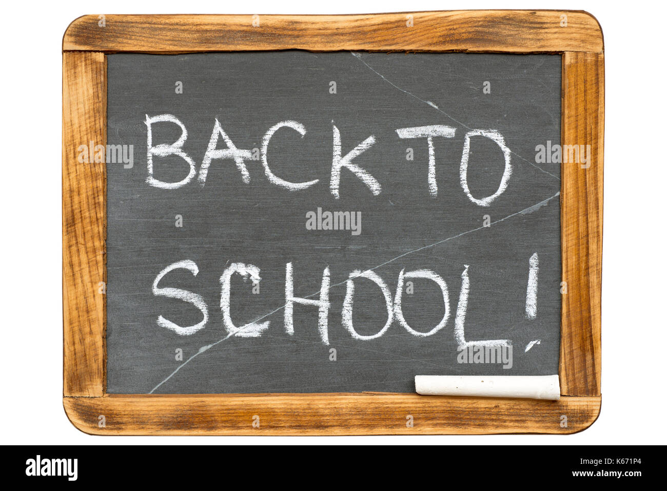 back to school phrase handwritten on vintage isolated slate chalkboard with piece of chalk Stock Photo