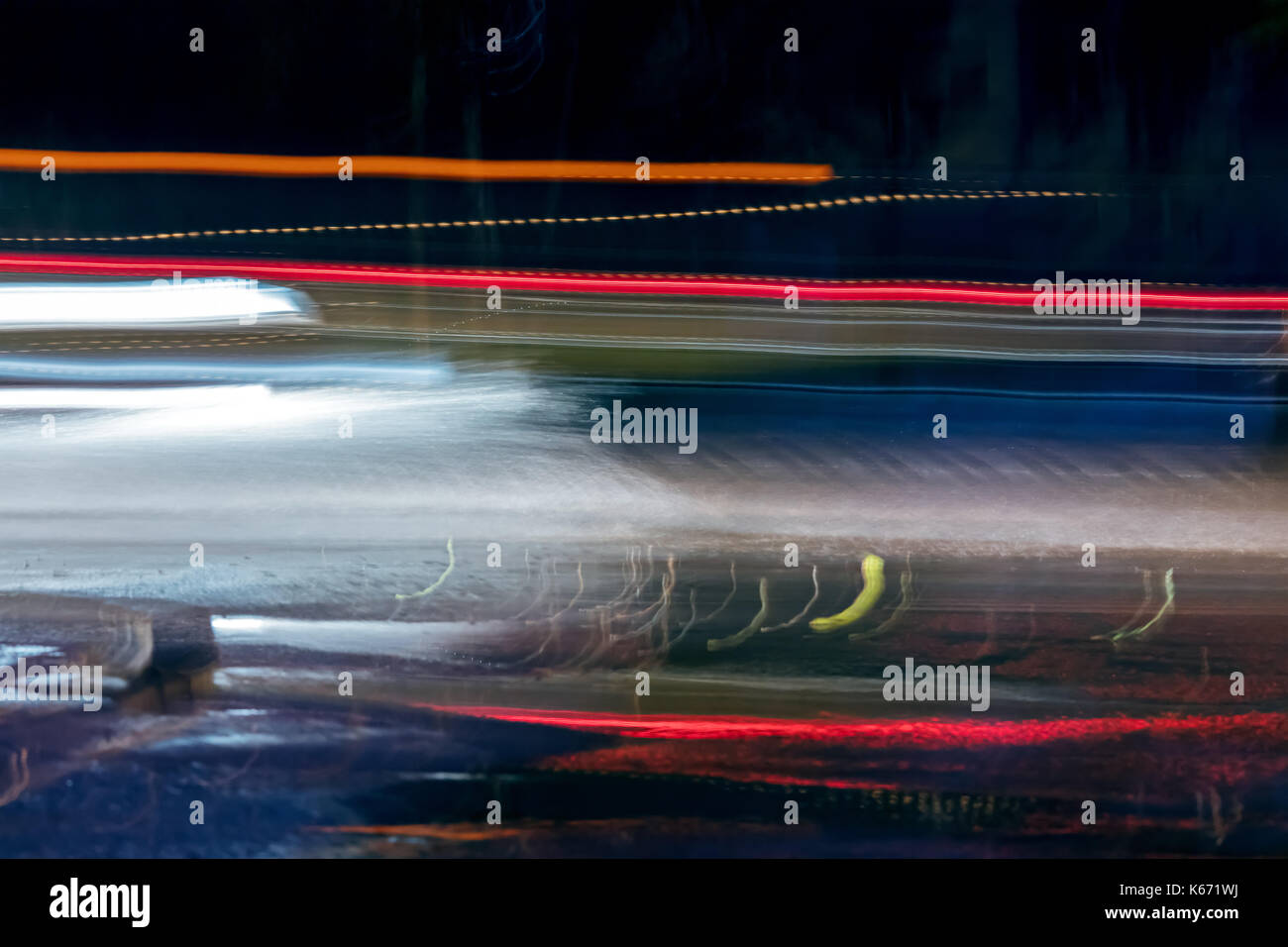 high speed traffic and blurred light trails at night time Stock Photo ...