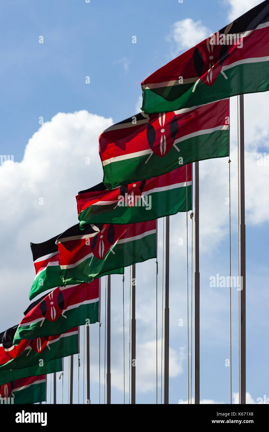 Kenyan flags on poles blowing in the wind on a sunny day, Nairobi