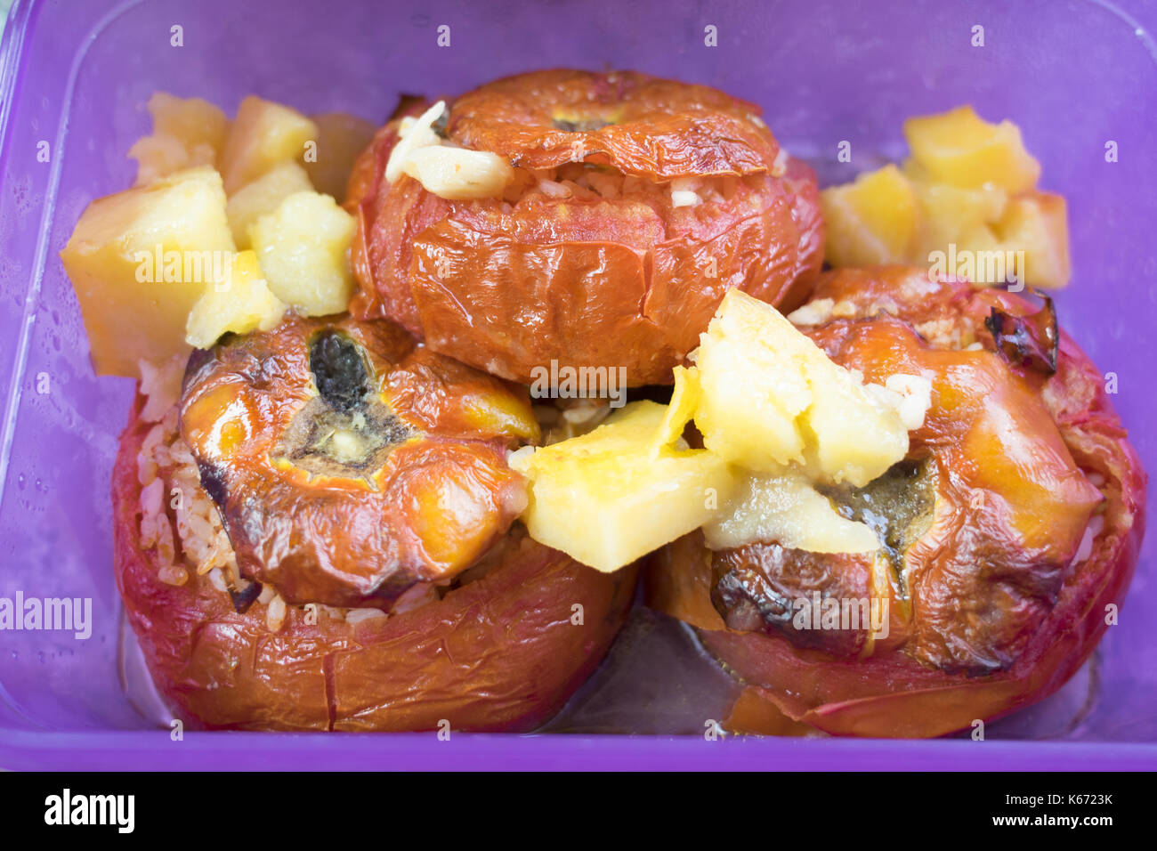 tomatoes stuffed with rice near the fresh fruit Stock Photo