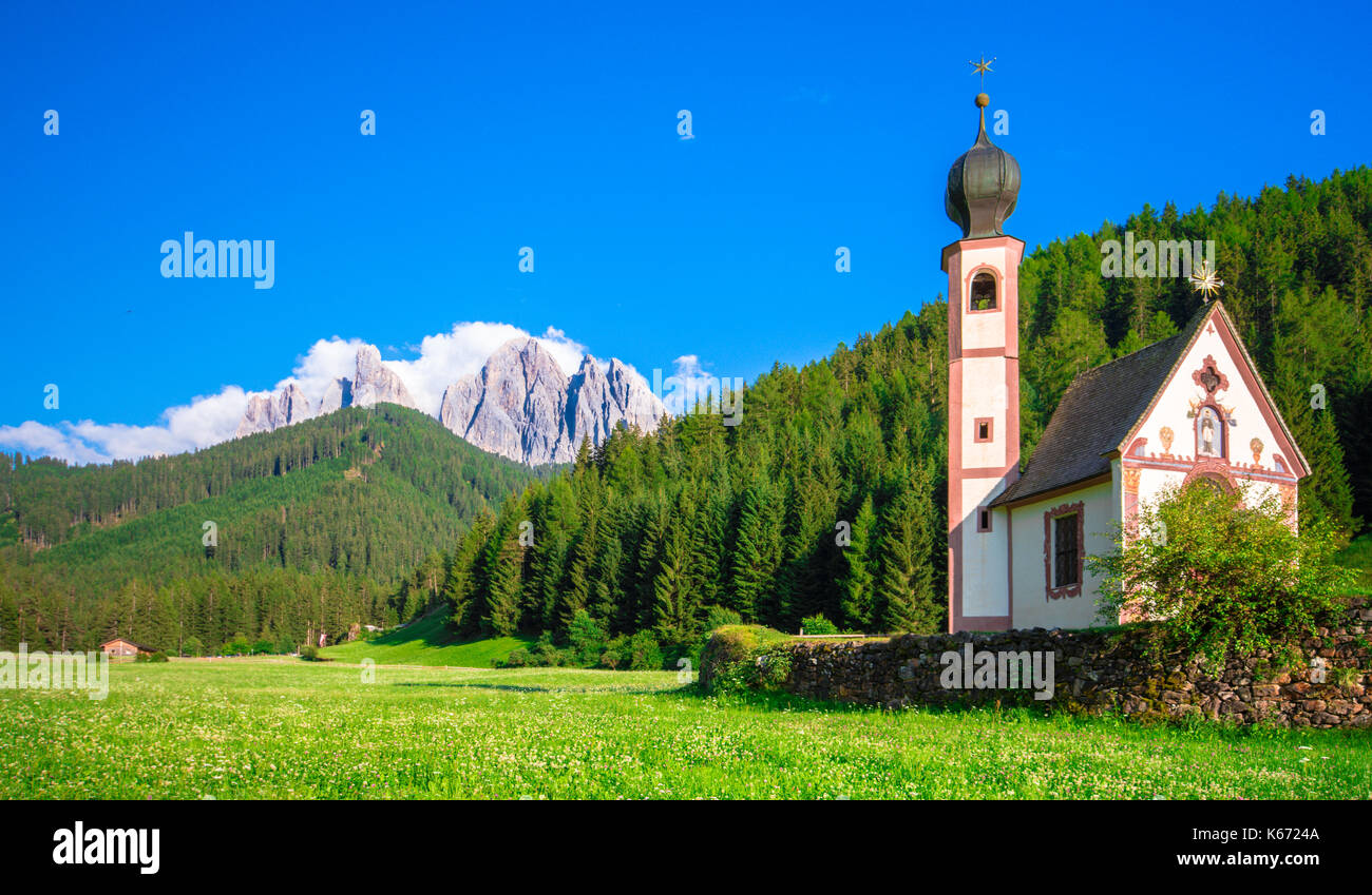 Traditional alpine St Johann church in Val di Funes valley, Santa Maddalena touristic village, Dolomites, Italy, Europe Stock Photo