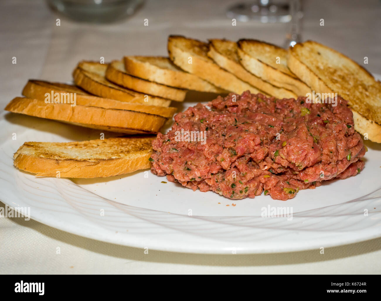 beef tartare with slices of toasted bread. steak tartare Stock Photo